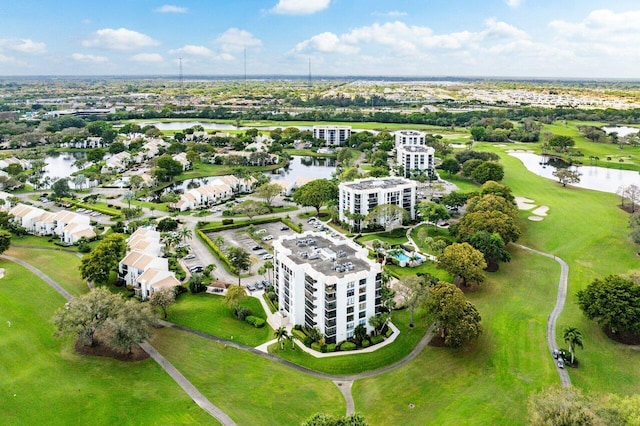 bird's eye view featuring a water view and golf course view