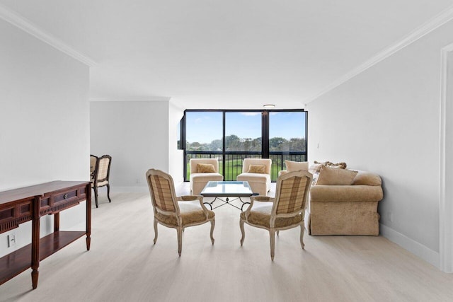 living room with crown molding, floor to ceiling windows, and light wood-style flooring