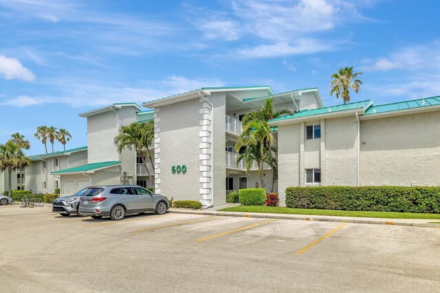 2400 S Ocean Dr Unit C623, Hutchinson Island, FL 34949 - view of building exterior featuring uncovered parking