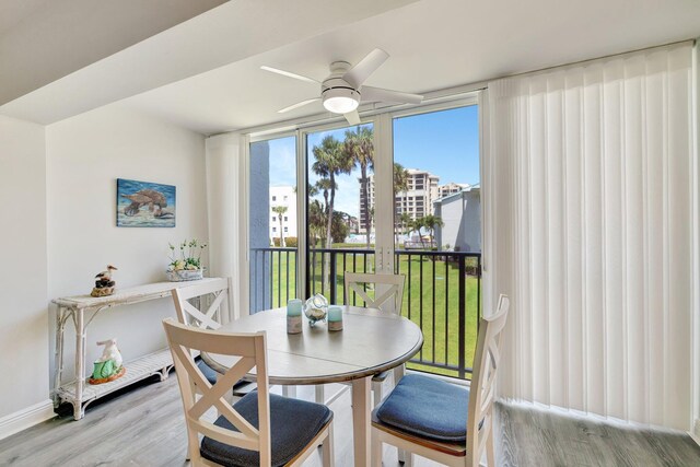 2400 S Ocean Dr Unit C623, Hutchinson Island, FL 34949 - dining space with light wood-style floors, ceiling fan, and baseboards