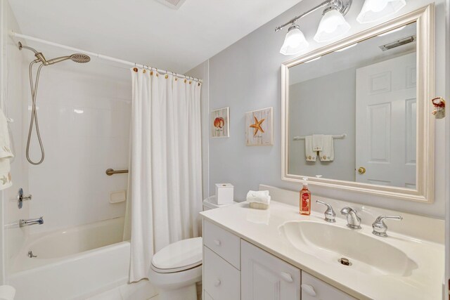 2400 S Ocean Dr Unit C623, Hutchinson Island, FL 34949 - full bathroom featuring toilet, shower / bath combo with shower curtain, and vanity
