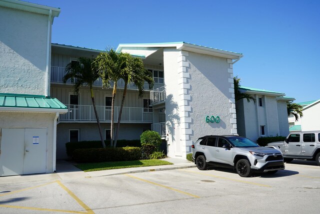 2400 S Ocean Dr Unit C623, Hutchinson Island, FL 34949 - view of building exterior with uncovered parking
