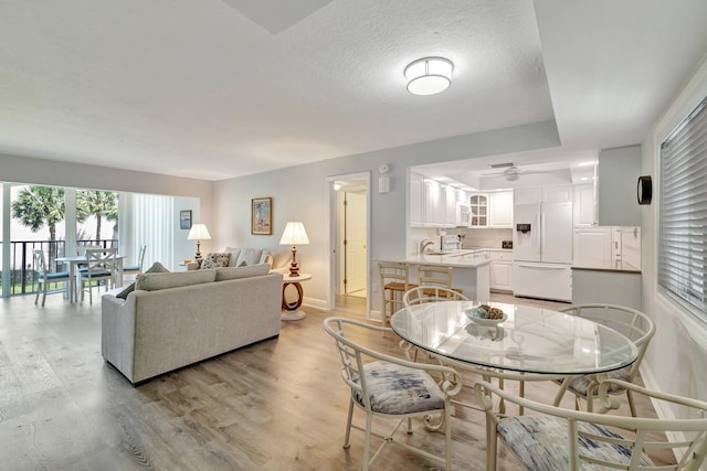 2400 S Ocean Dr Unit C623, Hutchinson Island, FL 34949 - living room featuring light wood-type flooring, baseboards, and ceiling fan