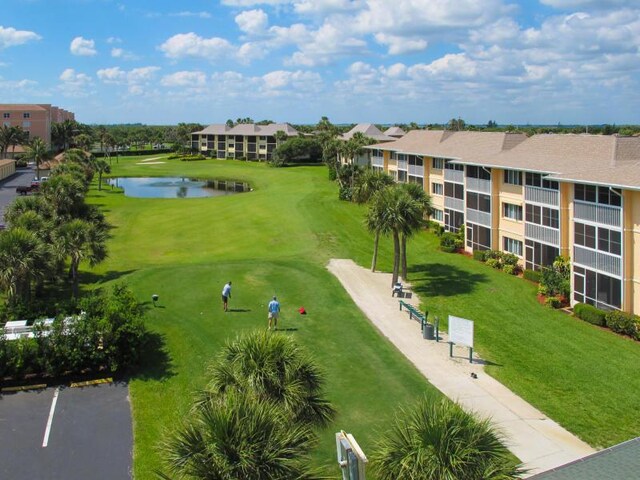 2400 S Ocean Dr Unit C623, Hutchinson Island, FL 34949 - view of property's community with a water view, a lawn, and view of golf course