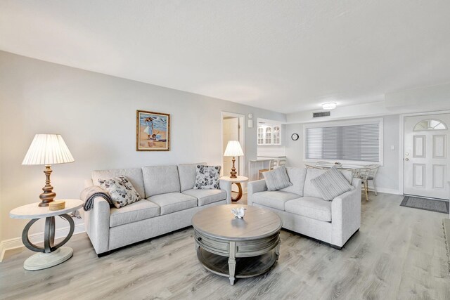 2400 S Ocean Dr Unit C623, Hutchinson Island, FL 34949 - living area with light wood-style flooring and baseboards