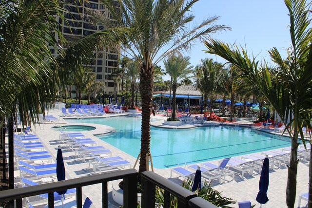 2400 S Ocean Dr Unit C623, Hutchinson Island, FL 34949 - community pool with a patio area and a community hot tub