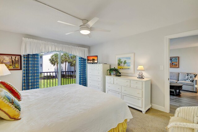 2400 S Ocean Dr Unit C623, Hutchinson Island, FL 34949 - bedroom featuring access to exterior, baseboards, light carpet, and ceiling fan