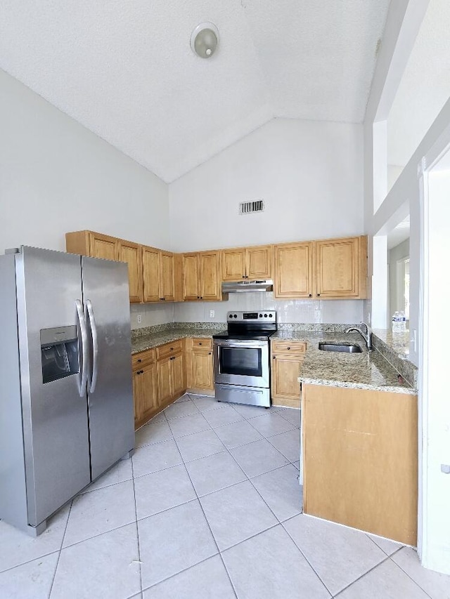 kitchen featuring light stone counters, visible vents, light tile patterned flooring, a sink, and stainless steel appliances