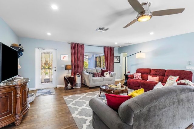 living area with visible vents, wood finished floors, recessed lighting, baseboards, and ceiling fan