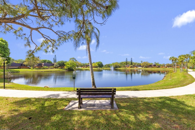 surrounding community featuring a yard and a water view