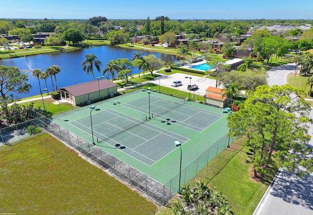 birds eye view of property featuring a water view