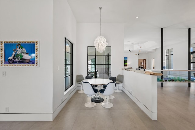 dining space featuring a notable chandelier