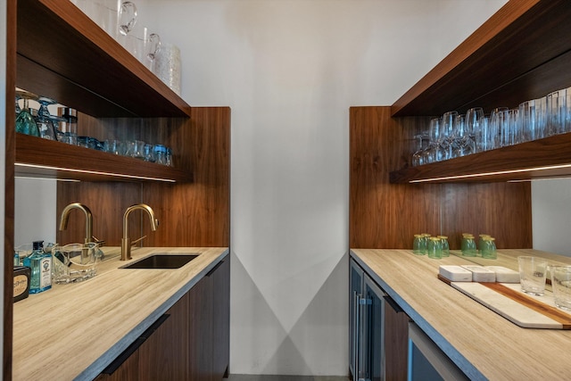 bar featuring indoor wet bar and a sink