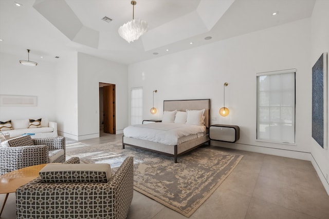 bedroom featuring tile patterned floors, visible vents, an inviting chandelier, a raised ceiling, and a towering ceiling