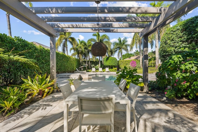 view of patio featuring outdoor dining space and a pergola