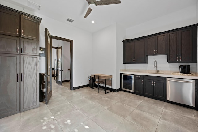 kitchen with visible vents, beverage cooler, a sink, light countertops, and dishwasher