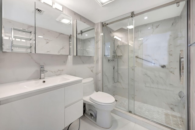 bathroom with visible vents, toilet, marble finish floor, a marble finish shower, and vanity