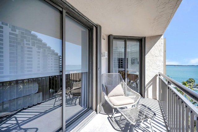 balcony featuring a water view