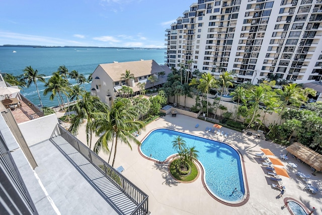 community pool featuring a water view