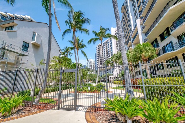 exterior space with a city view and fence