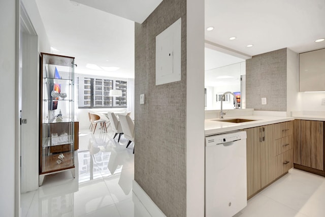 kitchen featuring a sink, modern cabinets, dishwasher, and light countertops