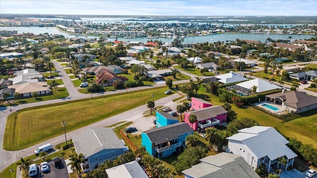 aerial view featuring a residential view and a water view