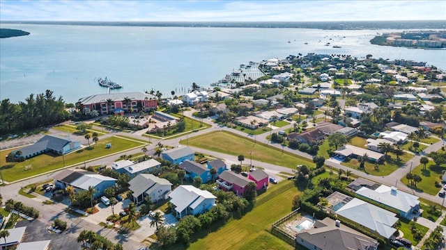 birds eye view of property with a residential view and a water view