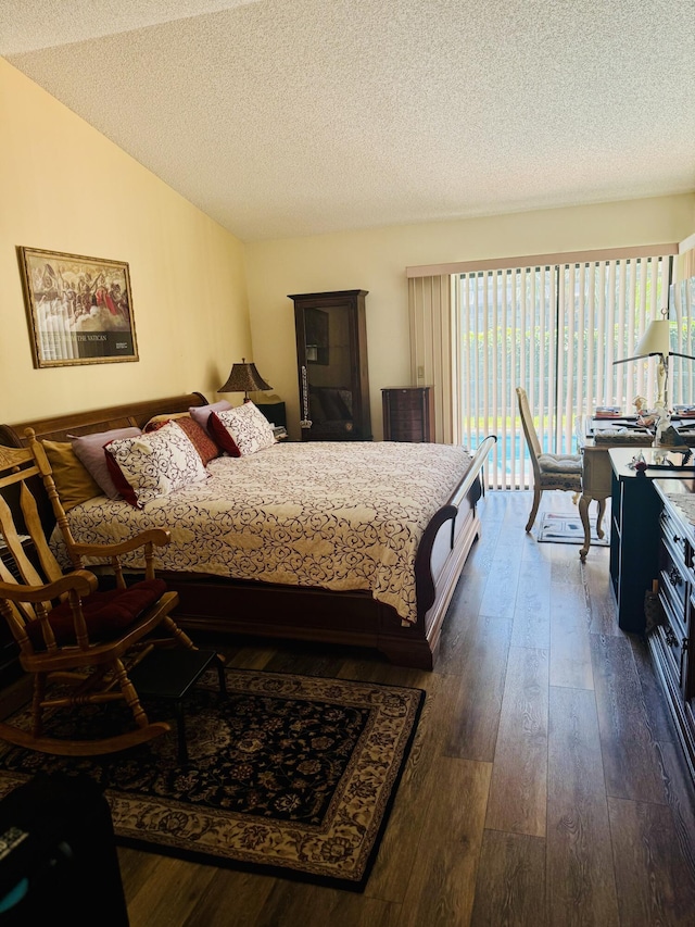 bedroom featuring a textured ceiling, access to exterior, dark wood-style floors, and vaulted ceiling