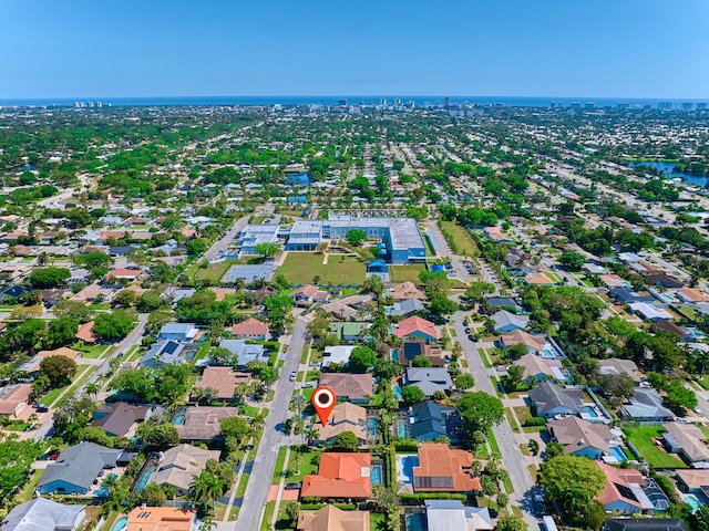 drone / aerial view with a residential view and a water view