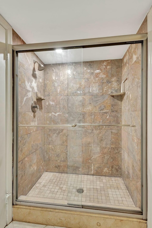 bathroom with a shower stall