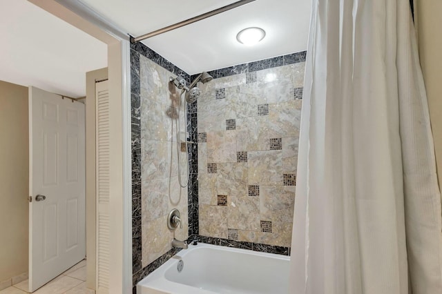 full bath with tile patterned floors, a closet, and shower / bath combo with shower curtain