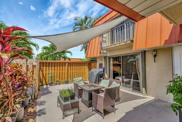 view of patio / terrace featuring area for grilling, an outdoor fire pit, and fence