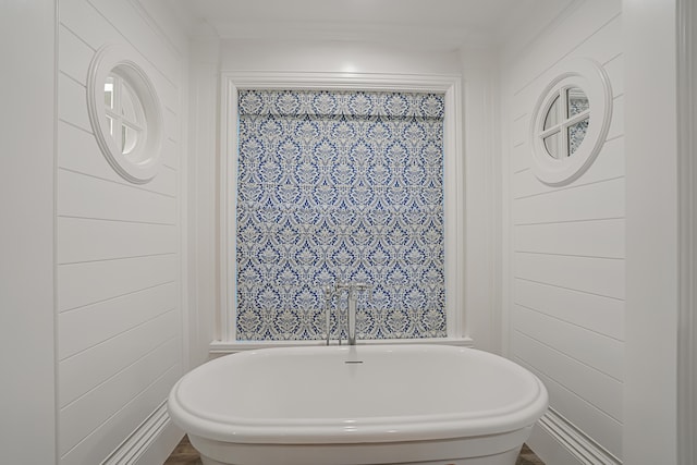 full bath featuring a freestanding tub