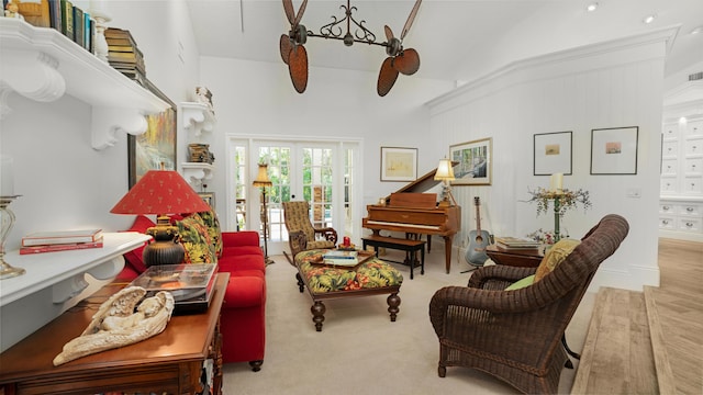 living room featuring french doors, carpet floors, visible vents, and vaulted ceiling