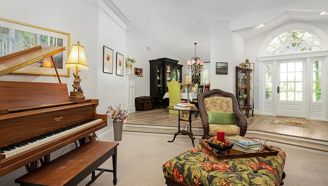 6000 Eagles Nest Dr, Jupiter, FL 33458 - living room featuring carpet floors, high vaulted ceiling, and a chandelier