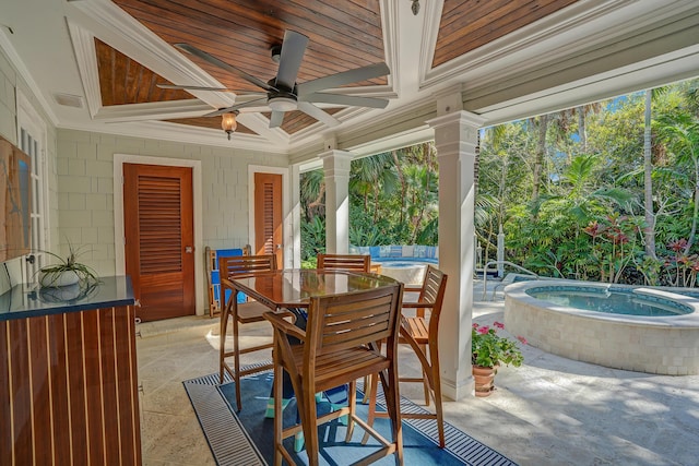 view of patio with visible vents, an in ground hot tub, ceiling fan, and outdoor dining space