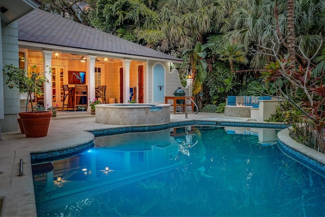 outdoor pool featuring a storage structure, a patio, an outdoor structure, and outdoor dry bar