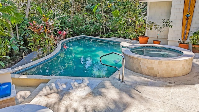 view of swimming pool with a pool with connected hot tub and a patio