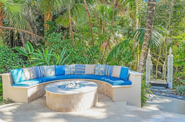 view of patio / terrace featuring an outdoor living space with a fire pit