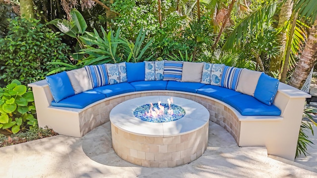 view of patio / terrace featuring an outdoor living space with a fire pit