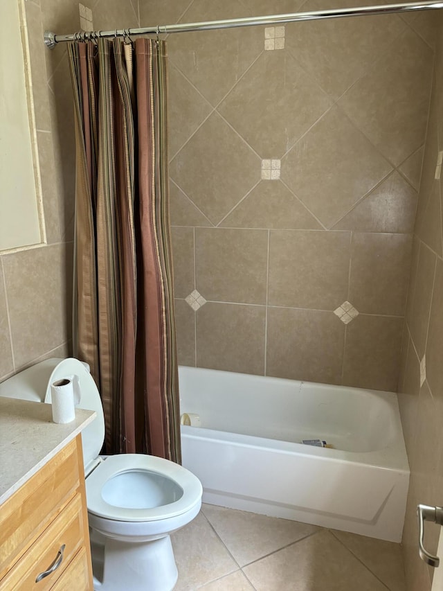 bathroom featuring tile patterned flooring, toilet, vanity, and shower / bathtub combination with curtain