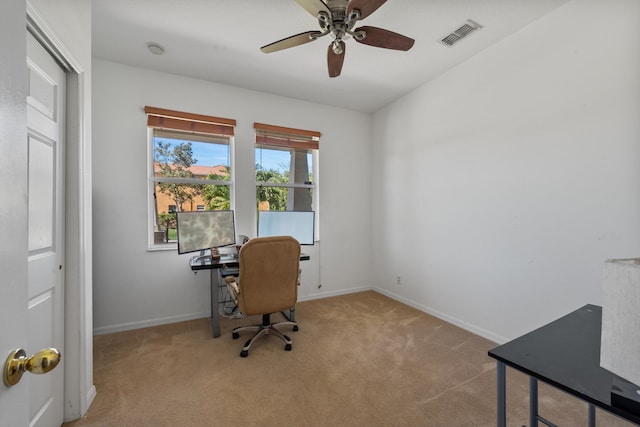 office area featuring visible vents, baseboards, ceiling fan, and carpet flooring