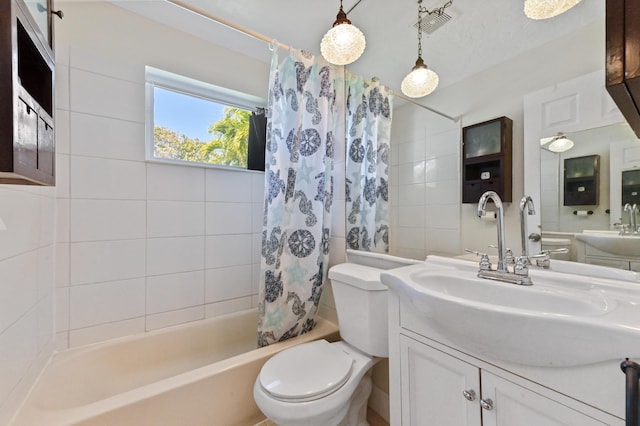 full bathroom featuring toilet, vanity, and shower / bath combo