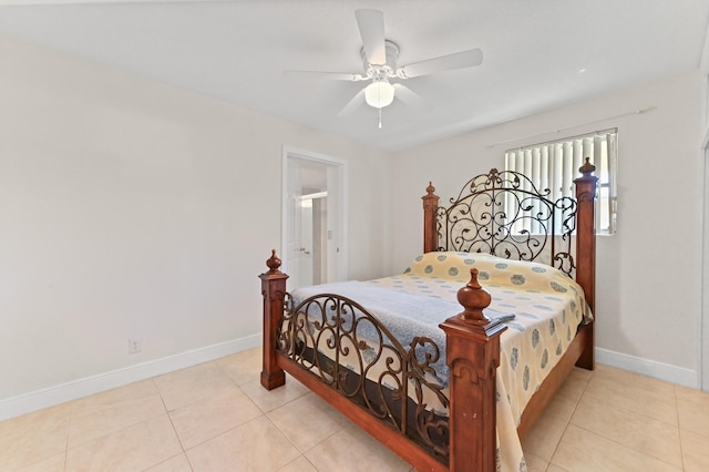 bedroom featuring light tile patterned floors, baseboards, and a ceiling fan