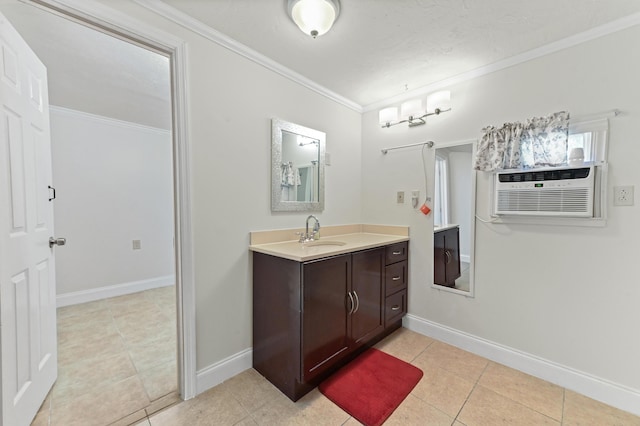 bathroom with vanity, baseboards, and ornamental molding