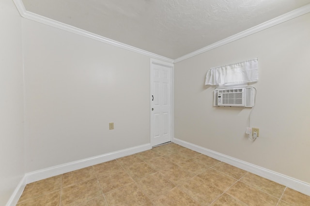 unfurnished room with light tile patterned floors, baseboards, a textured ceiling, and crown molding