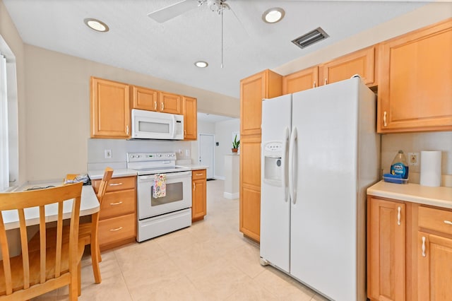 kitchen featuring visible vents, light brown cabinets, light countertops, recessed lighting, and white appliances