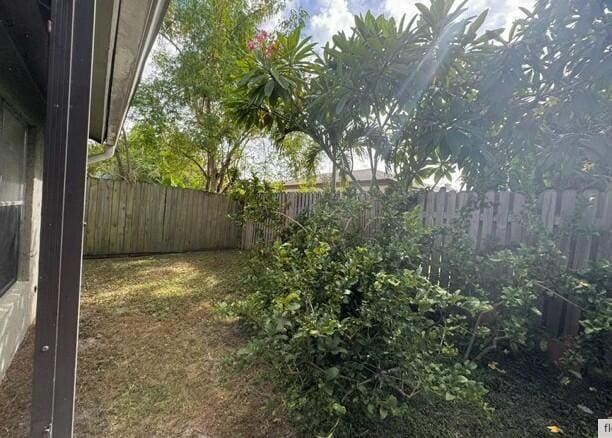 view of yard with a fenced backyard