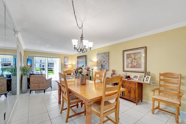 dining space with crown molding, light tile patterned floors, baseboards, and a chandelier