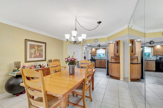 dining space featuring a notable chandelier, ornamental molding, and light tile patterned flooring